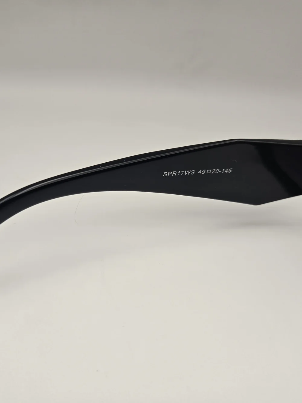 Prada Black Frame Sunglasses with Purple Gradient Lenses